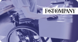 Person in a wheelchair working at a desk. Fast Company.