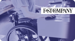 Person in a wheelchair working at a desk. Fast Company.